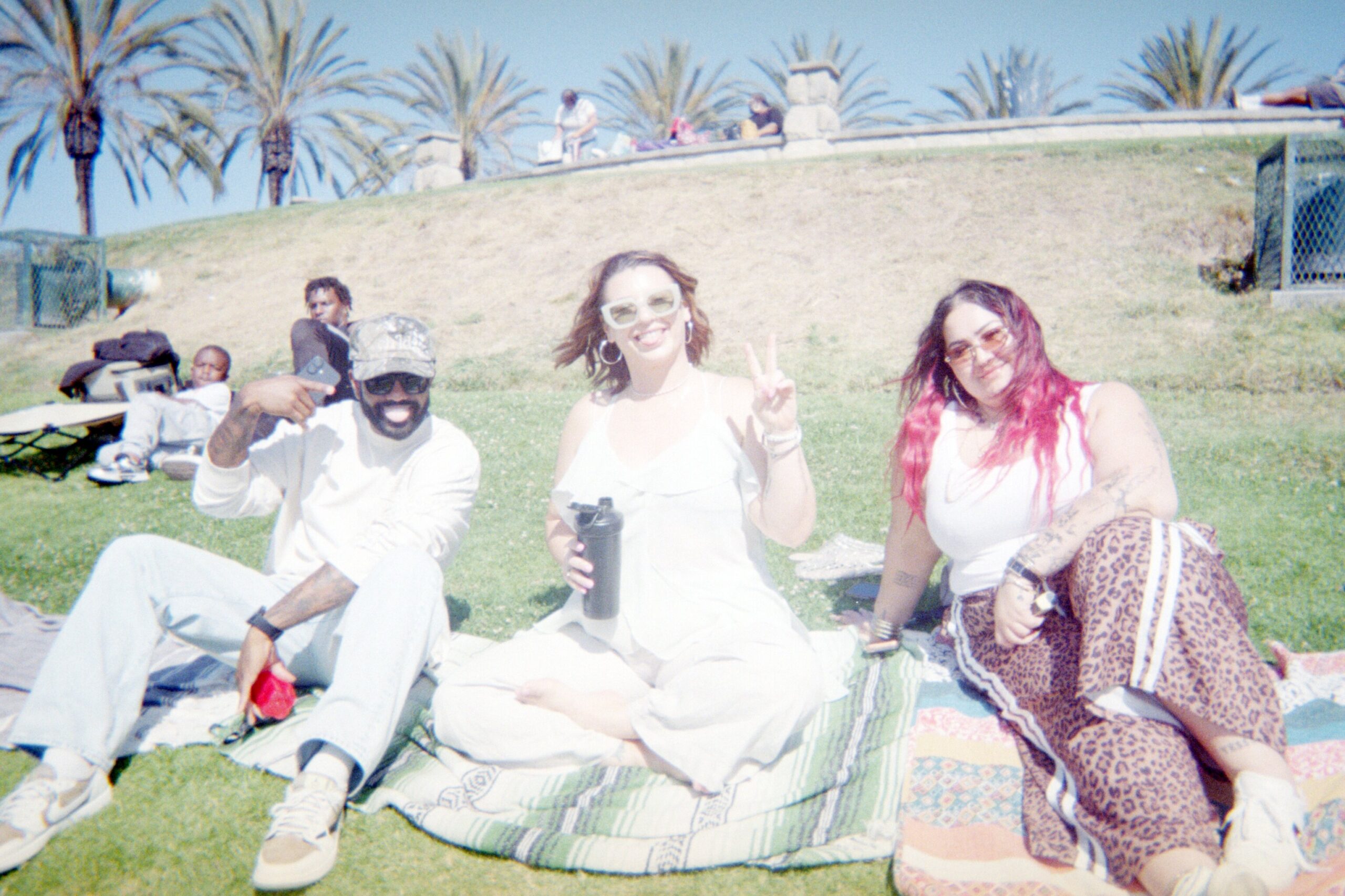 Sunset Sessions on film, friends on blankets on the hill