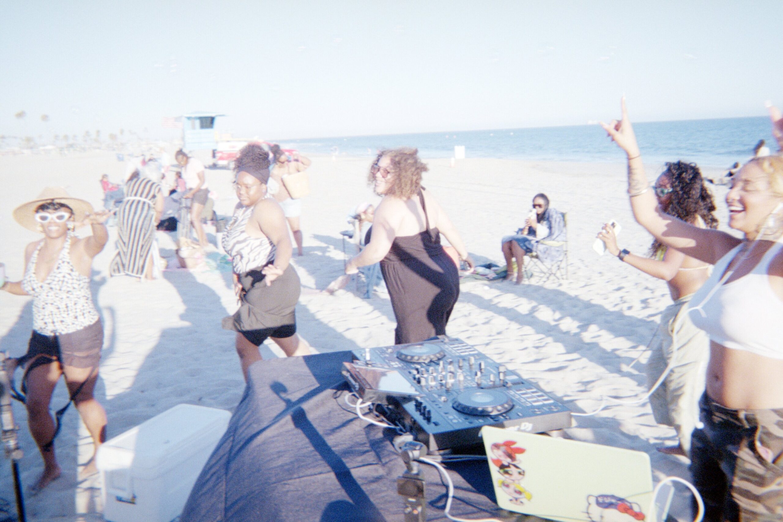 Sunset Sessions on film, dancing by the booth